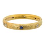 A sapphire and diamond hinged bangle,