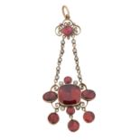 An early 19th century foil back garnet and split pearl pendant,
