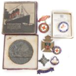 Lusitania medal and a collection of red cross badges,