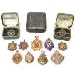 Nine hallmarked silver and gold sports medals