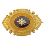 A Victorian garnet and split pearl brooch,