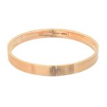 A 9ct gold bangle,