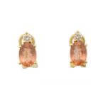 A pair of topaz and diamond earrings,
