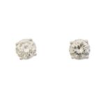A pair of brilliant cut diamond stud earrings,