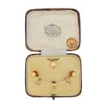 A cased selection of early 20th century dress studs,