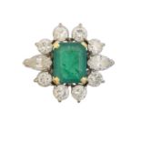 An 18ct gold emerald and diamond cluster ring by Boodles & Dunthorne,