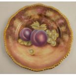A Royal Worcester side plate, with a gadroon border decorated with fruit by Leaman, diameter 6.75ins