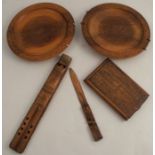 A collection of carved wooden items, to include two plates, diameter 9.5ins, a paper knife, a