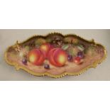 A Royal Worcester oval dish, with a shaped border decorated with hand painted fruit by Freeman,