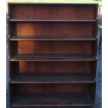 A mahogany waterfall bookcase, having six fitted shelves, width 42ins x depth 11.5ins x height 50.