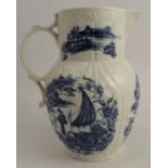 An 18th century Caughley cabbage leaf  mask jug, decorated with a bandstand and cormorant