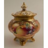 A Royal Worcester covered vase, on four splay feet, decorated with half round hand painted fruit