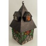 A late 19th century Arts and Crafts Prairie style iron and glass leaded light hall lantern, the