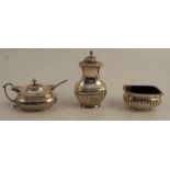 A silver three piece condiment set, with gadrooned lower body, Birmingham 1911, weight 4oz