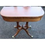 A 19th century mahogany D-shaped fold over card table, raised on four open reeded supports, and four