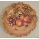 A Royal Worcester plate, with a star shaped border decorated with hand painted fruit by Freeman,