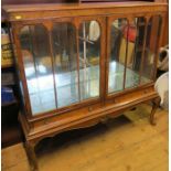 A 20th century burr walnut and walnut veneered display cabinet, fitted with a pair of doors, glass