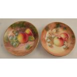 Two Royal Worcester circular pin trays, decorated with hand painted fruit by Maybury and Roberts,