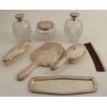 A 20th century 925 silver dressing table set, consisting of two large oval cut glass perfume bottles