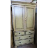 A 19th century style painted linen press, with faux bamboo decoration to the pair of doors,