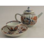 An 18th century Worcester tea bowl, and associated Chinese saucer, decorated with iron reds and