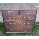 A late Georgian oak chest, of two short drawers over three graduated long drawers, raised on bracket