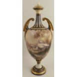 A Hadley's Worcester twin handled covered vase, painted with cranes in an all around landscape by