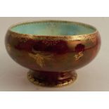 A Wedgwood lustre Empire bowl, decorated with butterflies and oriental motifs on a ruby lustre