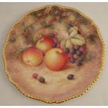 A Royal Worcester plate, with a gadroon border decorated with hand painted fruit by Ayrton, diameter