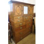 An Edwardian mahogany dressing chest, fitted with three doors to the upper section, with a central