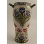 A Moorcroft pottery florian ware vase, decorated in the rose and forget me knot pattern, the vase