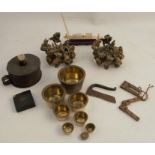 A set of graduated brass weight, together with a pair of gilt metal holders, a chamberstick and