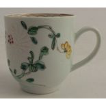 A Liverpool (Chaffers) coffee cup, decorated with coloured and white enamel, peonies and prunus in a