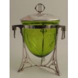 A WMF covered biscuit barrel, having a green glass liner, with three supports and drop handle,