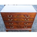 A Georgian mahogany caddy top chest of drawers, fitted with four graduated long drawers below a