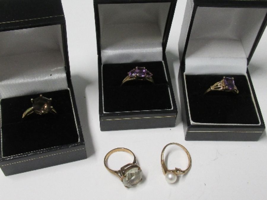 A collection of five 9 carat gold gem set dress rings, 13.6g gross