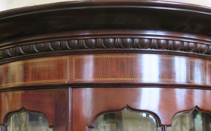 A mahogany display cabinet, of curved form, with inlaid and carved decoration, fitted with drawers - Image 5 of 5