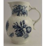 An 18th century Worcester blue and white cabbage leaf mask jug, decorated with chrysanthemum sprays,
