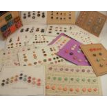 A collection of dress makers buttons, of various sizes, colours and designs, all sewn onto cards