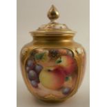 A Royal Worcester covered quarter lobed vase, decorated with half round hand painted fruit by