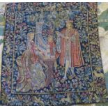 A Liberty style tapestry wall hanging, of three figures in medieval dress playing musical