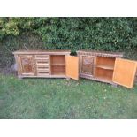 Two similar reproduction side boards, the one having a central bank of drawers, flanked by two