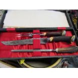 A cased carving set, with horn handles