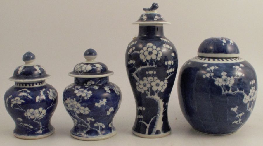 A collection of four Chinese blue and white prunus vases, to include two similar vases, height 7ins,