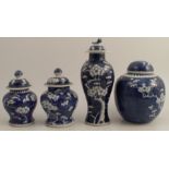 A collection of four Chinese blue and white prunus vases, to include two similar vases, height 7ins,