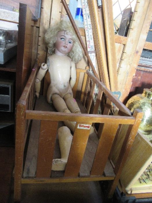 A jointed doll, marked Simon Halbig, af, together with a Triang doll's cot
