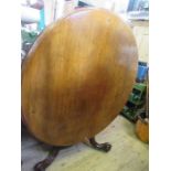 A 19th century mahogany breakfast table, raised on a carved pedestal, diameter 48ins