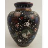 A cloisonne covered jar, decorated with flowers to a black ground, af, height 5.5ins