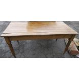 An Antique pine kitchen table, raised on turned legs and casters, 60ins x 30ins, height 29ins