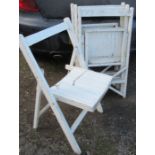 Four painted wooden folding chairs